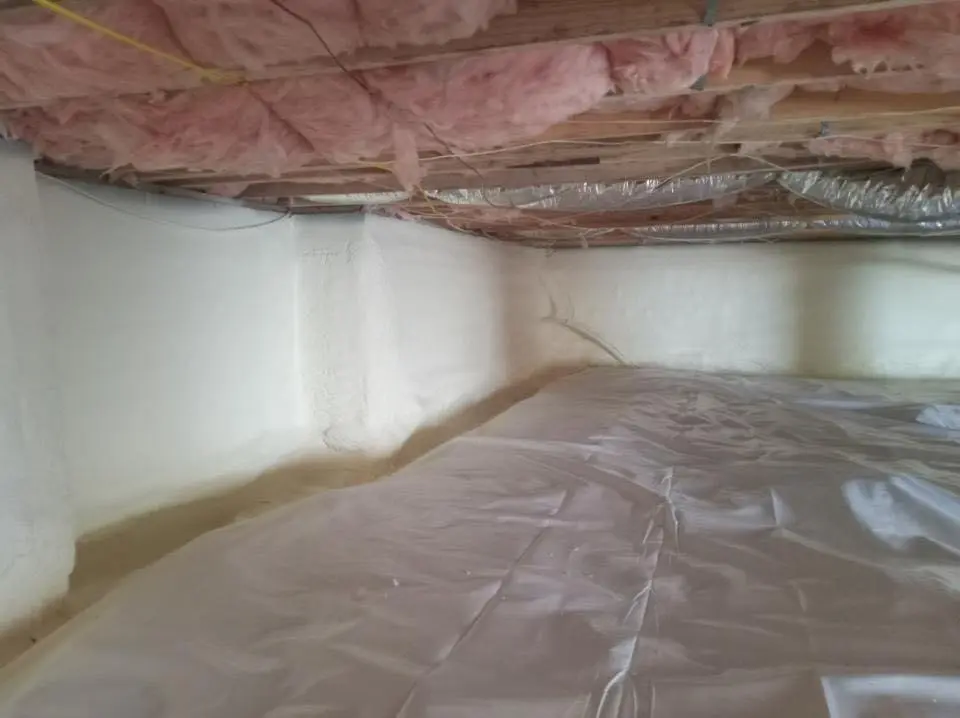 Crawl space encapsulation with closed-cell spray foam for Commercial Roof Restoration in Chesterton